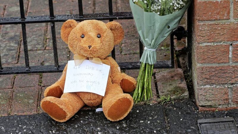 Flowers and teddy bears left outside the house where two children were stabbed in Brompton Park in Ardoyne, north Belfast. Picture by Mal McCann 
