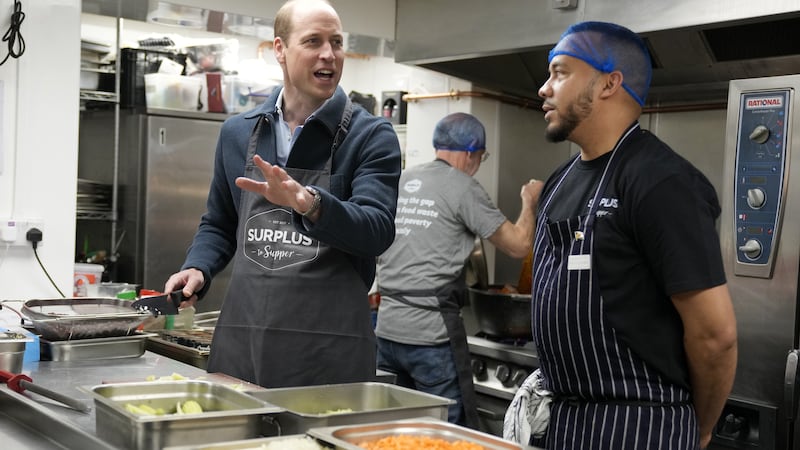 The Prince of Wales helped make bolognaise sauce during a visit to Surplus to Supper