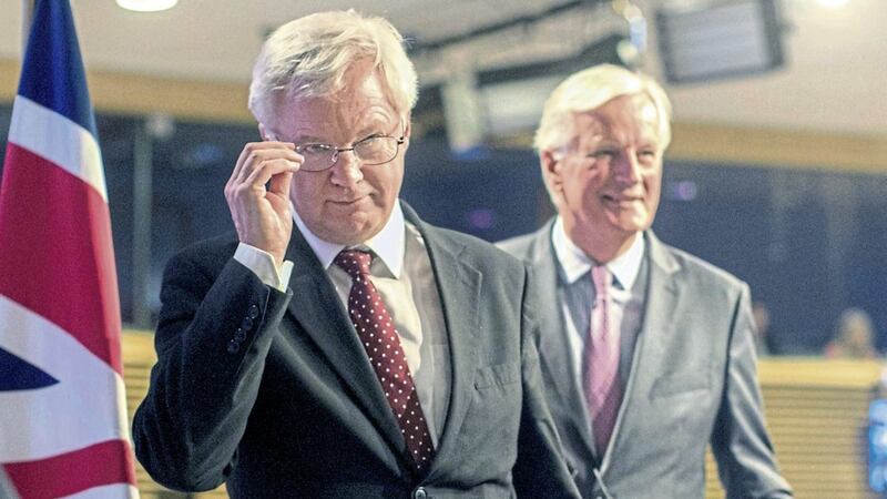 European Union chief Brexit negotiator Michel Barnier, right, and British Secretary of State for Exiting the European Union David Davis leave after a media conference at EU headquarters in Brussels on Thursday PICTURE: Olivier Matthys/AP 