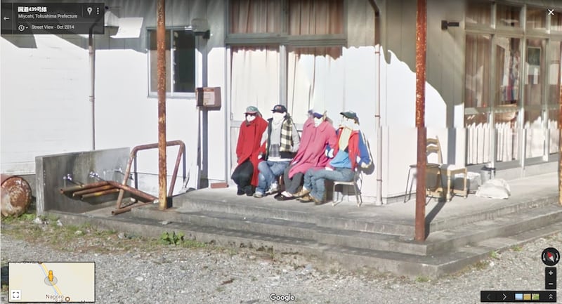 Dolls on a bench in the Japanese town