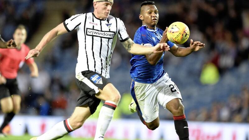 Rangers Alfredo Morelos tries to get past Dunfermilne&#39;s Lee Ashcroft during the Betfred Cup second round match at Ibrox. Rangers won 6-0 with Morelos scoring twice 