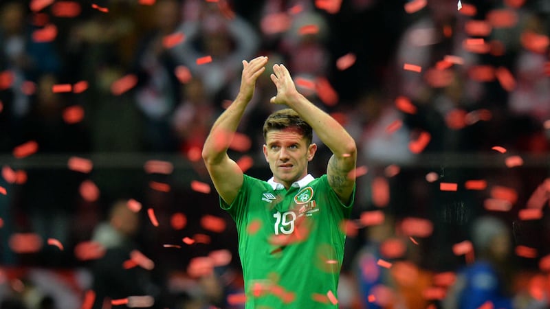 Ireland's Robbie Brady salutes the travelling support amidst Poland's celebratory ticker tape in Warsaw on Sunday night<br />Picture: PA&nbsp;