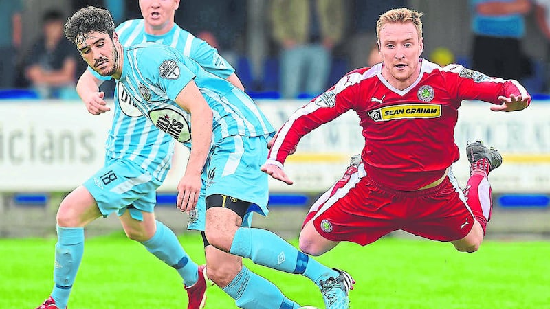 Cliftonville&rsquo;s Chris Curran and Warrenpoint's Jordan Dane during Sunday's game in Warrenpoint<br />Picture: Pacemaker