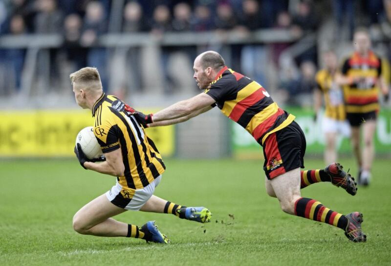 Rian O&#39;Neill of Crossmaglen get out in front of Cullyhanna&#39;s Ciaran McKeever at the Athletic Grounds on Sunday. Pic: Ian Magennis 