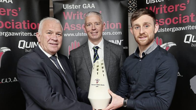 Fermanagh&#39;s Ciaran Corrigan receives the UGAAWA merit award for February from Quinn Building sales &amp; marketing executive, Seamus McMahon (left), and UGAAWA chairman John Martin Picture by Jim Dunne 