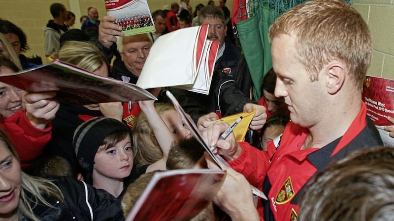 Down&#39;s Benny Coulter signs autographs for fans during a special team evening in Newry ahead of their All-Ireland Senior Football Championship final against Cork. Picture by Cliff Donaldson 