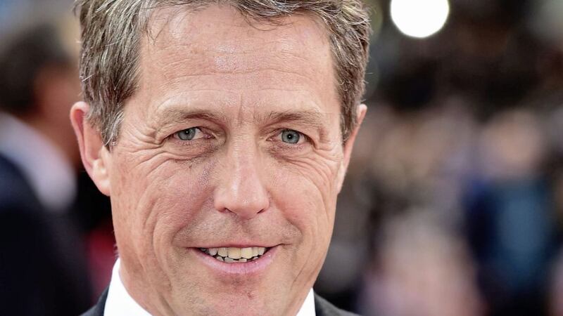 Hugh Grant criticised Theresa May for abandoning a Conservative commitment on press regulation 