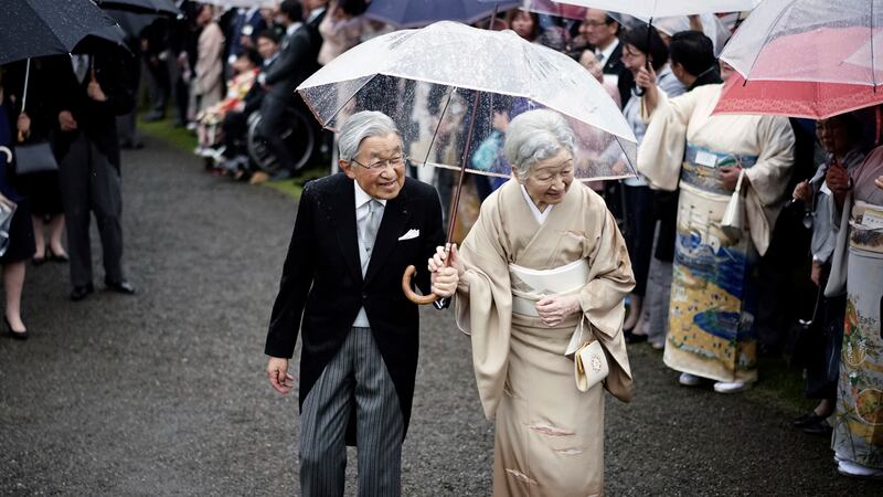 Japan’s Emperor Akihito and Empress Michiko greet guests at a garden party at the Akasaka Palace in Tokyo in 2018 (Eugene Hoshiko/AP)
