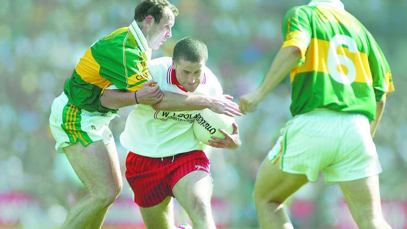 Tyrone&#39;s Stephen O&#39;Neill breaks through Kerry&#39;s Seamus Moynihan and Eamonn Fitzmaurice during the 2003 All-Ireland semi-final 