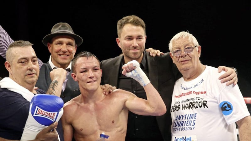 Sean O&#39;Hagan (left) celebrates with son Josh Warrington after the Leeds featherweight beat Dennis Tubieron in 2015. Also pcitured are Vinnie Jones and promoter Eddie Hearn. 