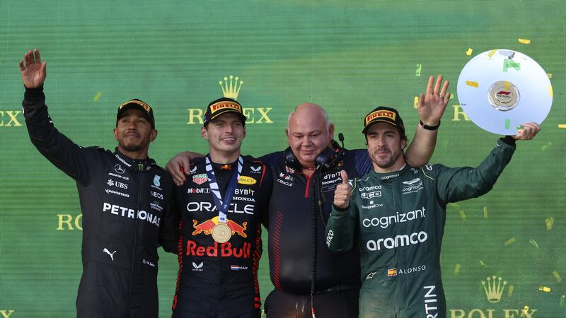 	Mercedes driver Lewis Hamilton of Britain, left, Red Bull driver Max Verstappen of Netherlands, second left, Rob Marshall the chief engineering of Red Bull and Aston Martin driver Fernando Alonso of Spain, right, stand on the podium after the Australian Formula One Grand Prix at Albert Park in Melbourne, Sunday, April 2, 2023. Verstappen won the race while Hamilton came second and Alonso took third. (AP Photo/Asanka Brendon Ratnayake)