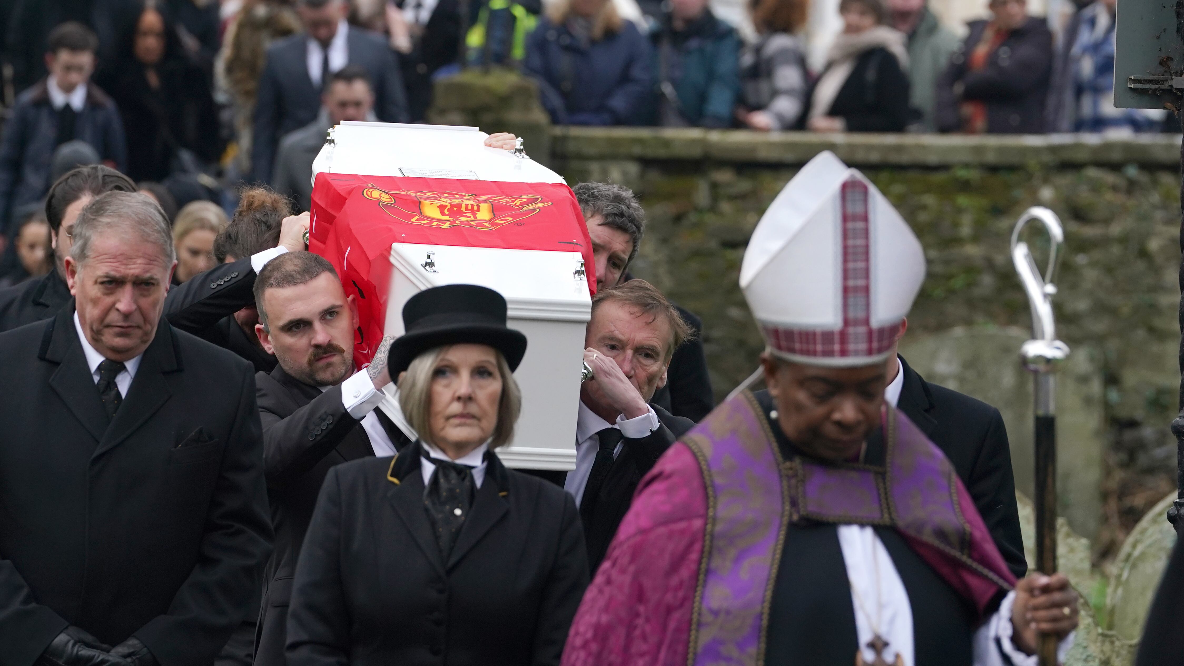 The coffin of William Brown is carried into St Mary And St Eanswythe Church, Folkestone