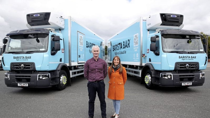 Gavin Hamill, logistics manager at Henderson Foodservice with Keavy O&rsquo;Mahony-Truesdale, barista bar brand manager, revealing the fully branded Barista Bar delivery lorries. 