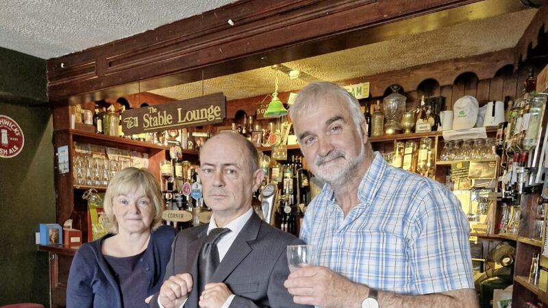 The poor 'deceased' Micky, a healthy looking Michael Rafferty (centre), gets support from the owner of the Corner House, Stephen McCahill, and baker Mary McHugh before the Americans pile into the 'wake house' and get a real surprise... 