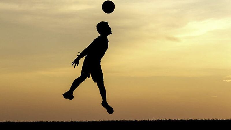 Primary-age children have been banned from heading footballs during training 