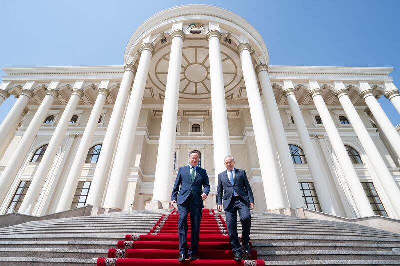 Lord Cameron leaves the Presidential Palace in Dushanbe with Tajik foreign minister Sirojiddin Muhriddin after meeting the president as he visits Tajikistan