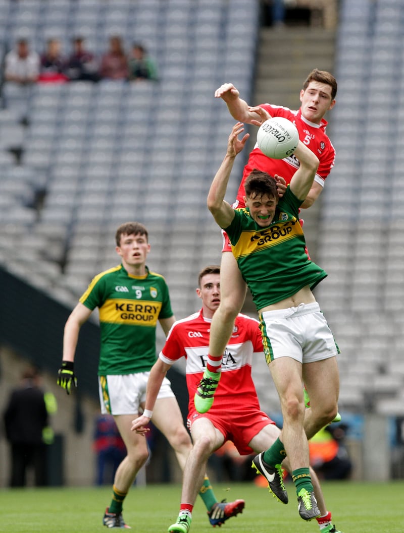 <span style="font-family: Helvetica;  text-size-adjust: auto;">Setting the bar high: Derry captain Padraig McGrogan, in action against Kerry last year, is one of four Oak Leaf players named in the minor team of the year</span>