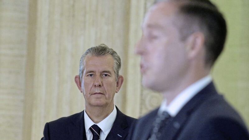 Edwin Poots looks on as Paul Givan talks to the Press. Picture By Hugh Russell.
