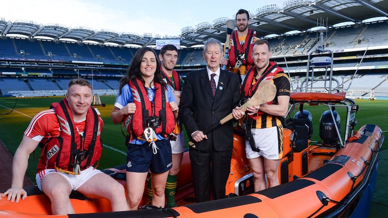 <address>Cork footballer Brian Hurley, Dublin ladies footballer Lyndsey Davey, Kerry footballer Killian Young, broadcaster M&iacute;che&aacute;l &Oacute; Muircheartaigh, Antrim hurler Neil McManus, and Kilkenny hurler Jackie Tyrell, at Croke Park as the RNLI and the GAA announced a major partnership aimed at reducing the number of people who lose their lives though drowning in Ireland.<br />Photo by Seb Daly/Sportsfile