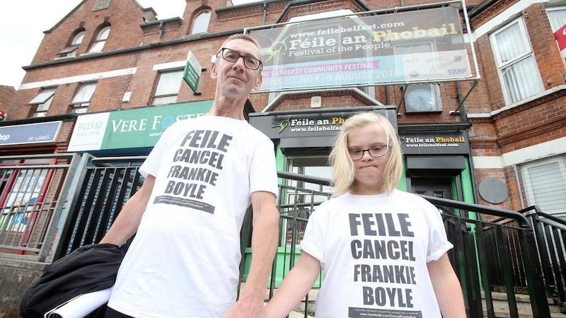 John Lundy with his daughter Mia protest and hand in a petition to cancel Frankie Boyle as the main act in this year&#39;s Feile an Phobail, Picture Mal McCann. 