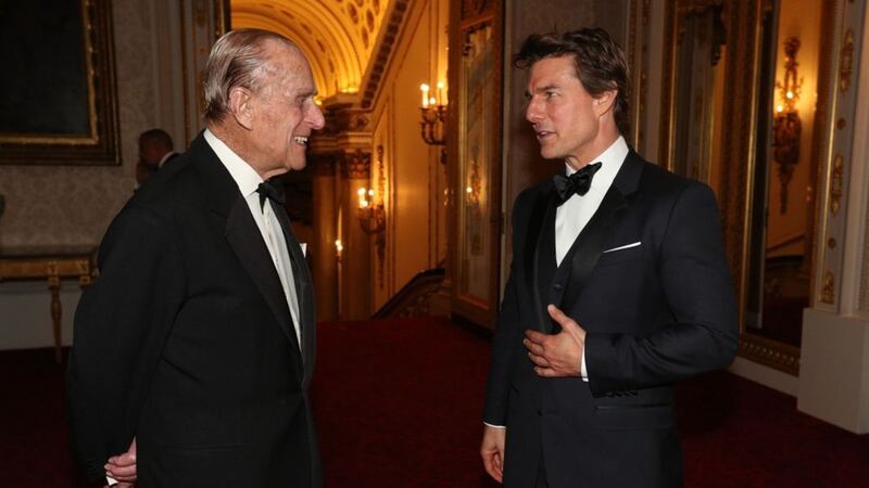 Tom Cruise shares a chuckle with the Duke Of Edinburgh at Buckingham Palace