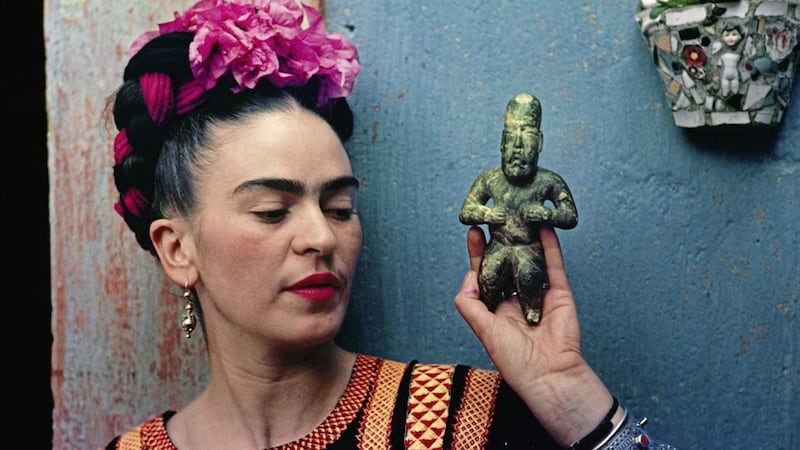Frida Kahlo with Olmec figurine, from the new exhibition at The Victoria and Albert Museum in London 