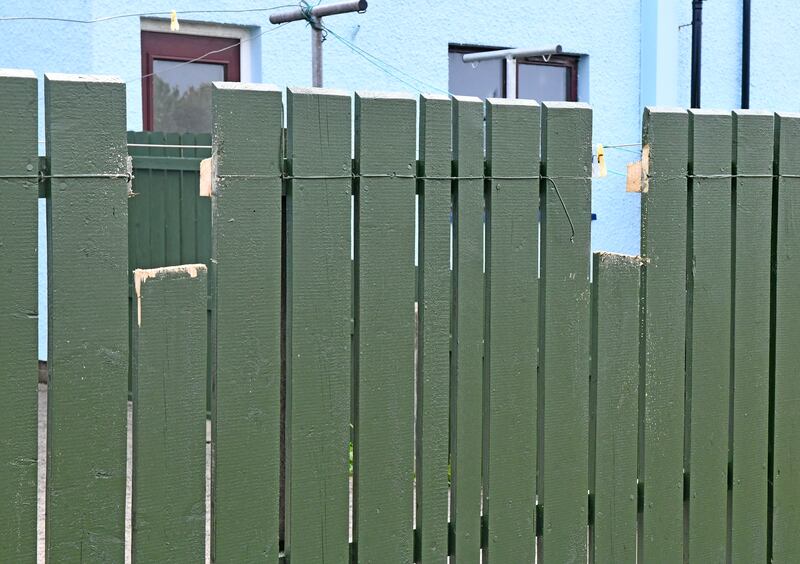 The fence against which a man was ‘ crucified’ in Bushmills, County Antrim overnight.  

 

The man was nailed to the fence and 100 yards away two vehicles were burnt following the savage overnight attack. 

 

One of the vans is believed to be connected to the victim who is currently in hospital. 

 

Police have issued the following statement in relation to the incident : 

 

“ Detectives are appealing for information following a report of a serious assault in Bushmills in the early hours of today, Sunday 5th May.   

Shortly after midnight, it was reported that a man had been discovered ‘nailed’ to a fence with a nail through each hand. 

      The man, aged in his 20s, also had injuries to his nose and is being treated in hospital where his condition is described as not life-threatening.   Also in the public car park near Dundarave Park, two vans including one belonging to the injured man were on fire. Crews from NI Fire and Rescue Service also attended, extensive damage was caused to both vehicles.   

      Graffiti found on a nearby gable wall of public toilets is being linked to the assault and arson.   Detective Inspector Lyttle said: “This was a sinister attack which has left this man with potentially life-changing injuries. 

      Everyone has the right to live their life free from the threat of violence and this brutal attack by people who violate the human rights of others must be universally condemned.   "We live in a democratic society where there is no justification for this. 

     Those responsible brutalise their own communities and control others through intimidation and violence.   “This happened in a residential area with a number of holiday lets which would be busy during this bank holiday weekend and we are asking anyone who noticed anything or who may have dashcam footage to contact us urgently on 101 or confidently to Crimestoppers.  

     “Our enquiries are ongoing and we would appeal to anyone who was in the area at the time and has any information, including dash-cam or other footage, to contact police on 101 quoting reference 13 of 5/5/24.”