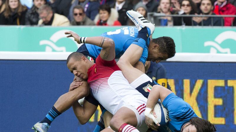 France's Gael Fickou is tackled by Italy's Kelly Haimona and Luke Joseph McLean (right) during Saturday's Six Nations clash at Stade de France in Paris<br />Picture by PA&nbsp;