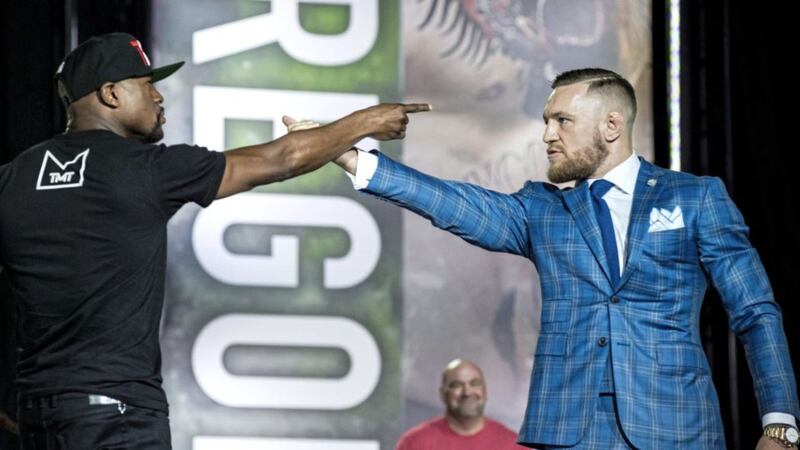 Floyd Mayweather, left, and Conor McGregor during a promotional stop for this weekend&#39;s fight in Las Vegas. Picture by Christopher Katsarov via AP 