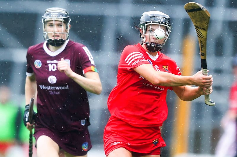 Cork's Saoirse McCarthy hits the ball past Carrie Dolan of Galway    Picture: Tom Maher/Inpho