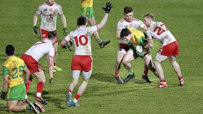 Tyrone&#39;s Padraig Hampsey (6) and Frank Burns (27) move in to tackle Stephen McBrearty of Donegal during the Allianz Football League clash at Healy Park, Omagh on March 10 2018. Picture: Margaret McLaughlin. 