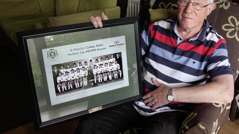 Phil Stuart with his framed photograph of St. Malachy&#39;s College McRory Cup team 1969-70. Picture Ann McManus 