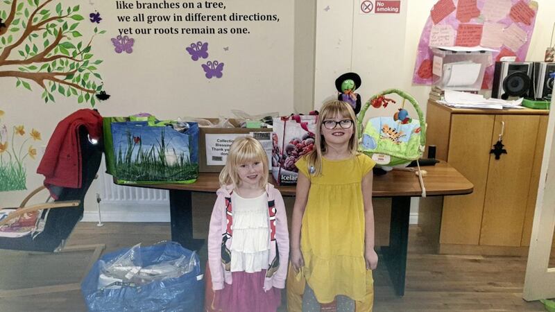 Violet dropping off donations with her sister Charlotte at Depaul&#39;s Cloverhill family service 