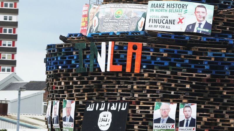 A bonfire in Conway Street, Belfast adorned with election posters of Sinn F&eacute;in's Paul Maskey MP and John Finucane, son of murdered Belfast solicitor Pat Finucane and an Islamic State flag&nbsp;