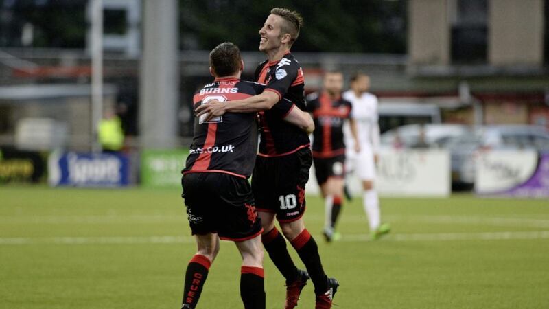 Michael Carvill celebrates his goal with team-mate Billy Joe Burns at Seaview Picture by Colm Lenaghan/Pacemaker Press 
