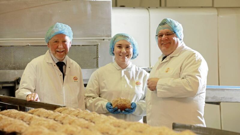 Janine Shilleto, Asda&rsquo;s senior buying manager, is pictured during a recent visit to Irwin&rsquo;s Bakery with Brian Irwin, chairman of Irwin&rsquo;s and Michael McCallion, buying manager for Asda NI. 