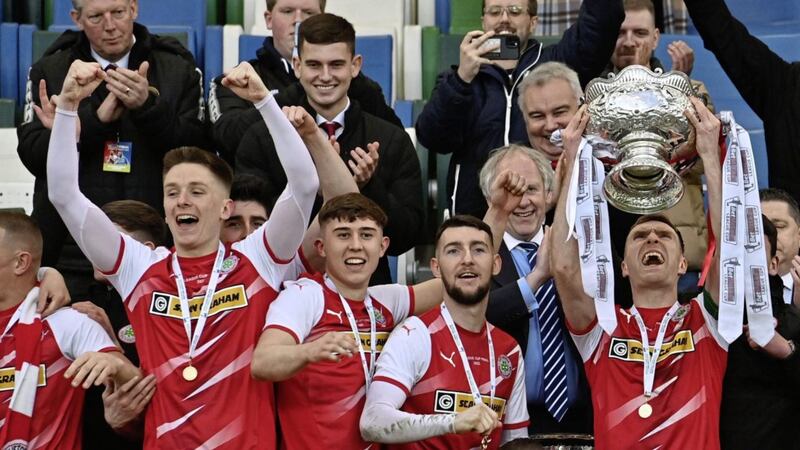 Cliftonville captain Chris Curran lifts the League Cup after beating Coleraine 4-3 after extra-time Pic Colm Lenaghan/ Pacemaker 