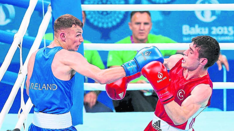 Ireland&#39;s Sean McComb (Blue) in action against Yasin Yilmaz (Red) of Turkey in their Men&#39;s Light 60kg quarter-final clash in Baku, Azerbaijan 