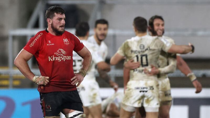 Ulster's Sean Reidy (left) appears dejected after the final whistle as Toulouse players celebrate their European Champions Cup Group B victory at the Kingspan Stadium, Belfast on&nbsp;Friday December 11, 2020.Picture by&nbsp;Liam McBurney/PA Wire.&nbsp;