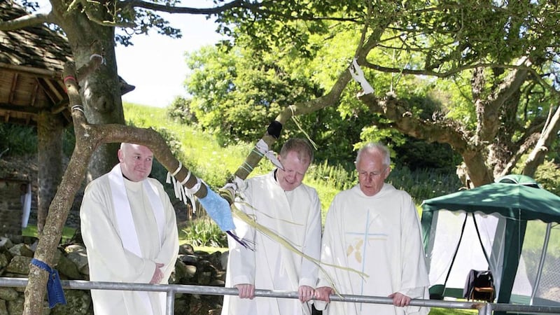 More than 100 pilgrims visited St Cooey&#39;s Wells near Portaferry on Sunday, where Mass was celebrated to mark National Holy Wells Day. Pictured, left to right, are Down and Connor press officer Fr Eddie Magee, who is from the area, Fr Patrick Mulholland, parish priest of St Patrick&#39;s, Portaferry, and Strangford parish priest Fr John McManus. Picture by Bill Smyth. 