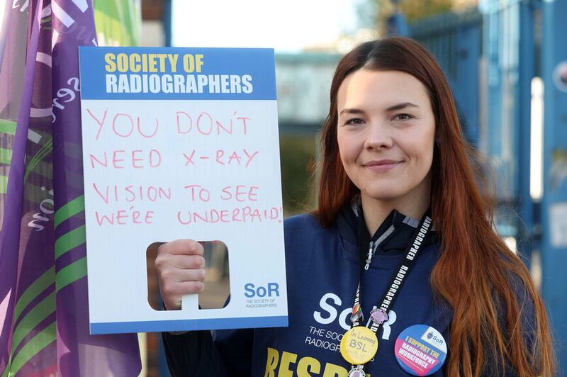 Radiographer Jessica Rush on the picket line at the Royal Victoria Hospital as thousands of health and social care workers in Northern Ireland have begun a 48-hour strike as part of a pay dispute. Picture Mal McCann.