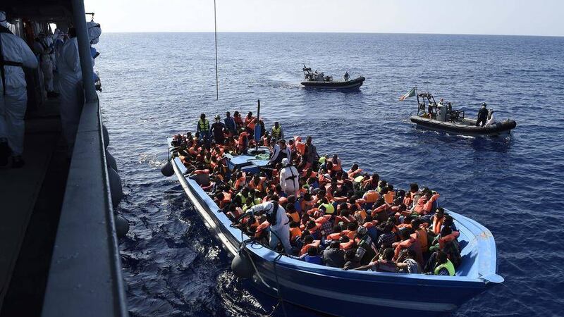 Handout photo issued by Irish Defence Forces in June this year of the operation by members of the Irish Navy vessel LE Eithne as they rescue refugees in the ongoing humanitarian mission in the Mediterranean. Today, 50 bodies from a boat were found off the coast of Libya