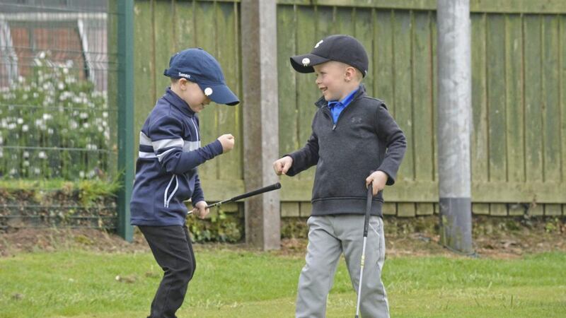 &nbsp;Fist bumps reflect a great day's play in the US Kids Summer tour at Lurgan Golf Club