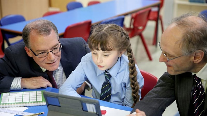 Education Minister Peter Weir visits St John the Baptist PS in west Belfast to announce the School Enhancement Project in which 18 schools will benefit from a &pound;45m investment in their buildings and estates. Photo: Mal McCann 