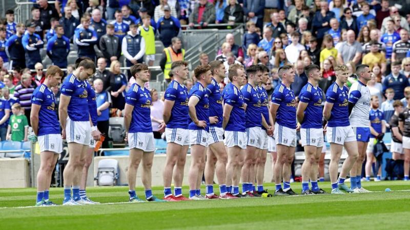 The Cavan team observe a minute's silence for Tyrone hurler Damien Casey who tragically died on holiday Picture: Philip Walsh