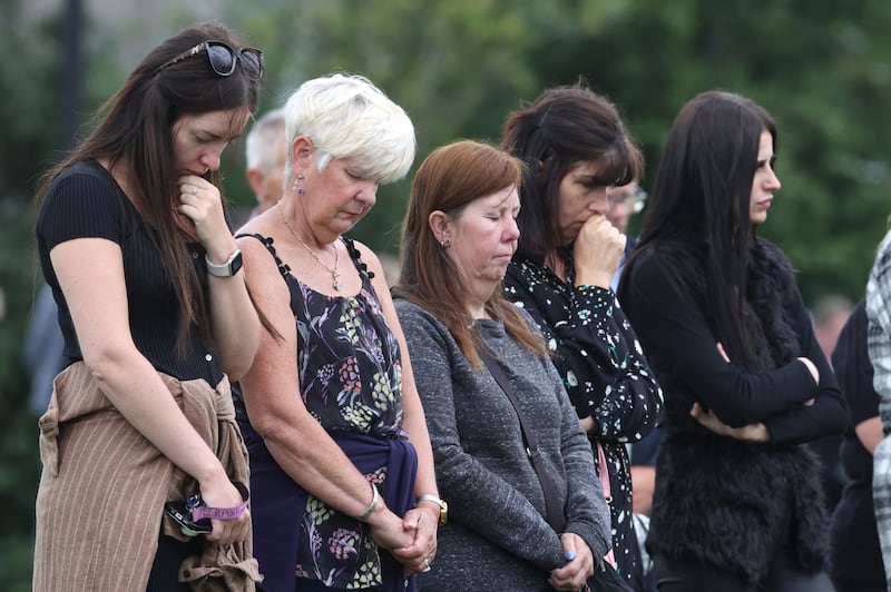 Members of the public in King George Harryville Park, Ballymena, after a service of thanksgiving for the life of Chloe Mitchell which was shown on a large screen. Picture by Liam McBurney/PA Wire