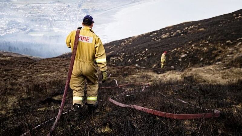 &nbsp;Firefighters tackle a large gorse fire in the Slieve Donard. Picture by Conor Kinahan/Pacemaker Press..