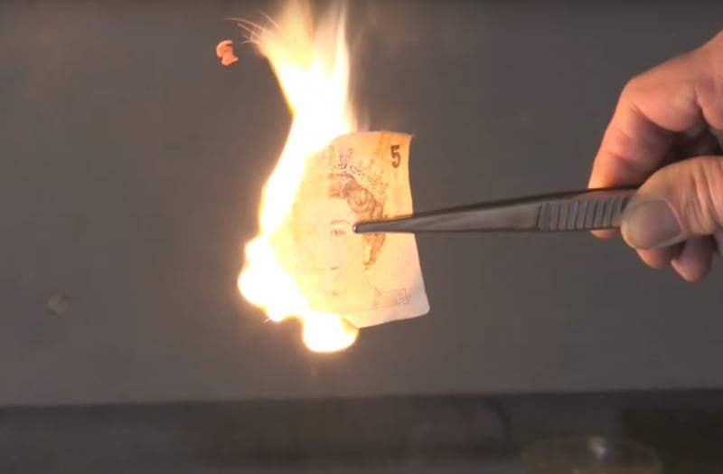 The burning paper note