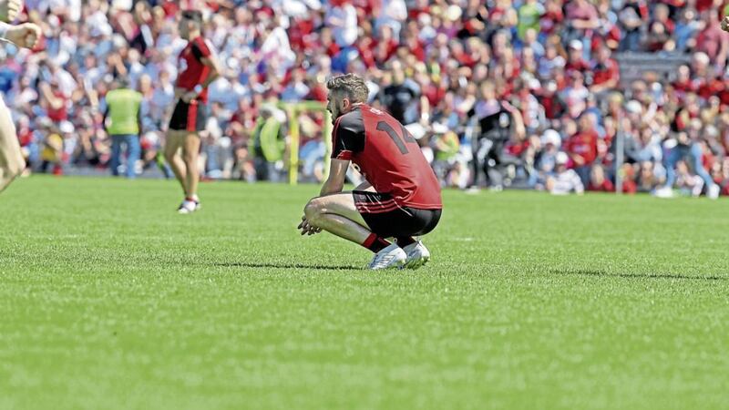 Down&#39;s Connaire Harrison cuts a disconsolate figure after the Mournemen&#39;s Ulster SFC final loss to Tyrone last Sunda Picture by Philip Walsh 
