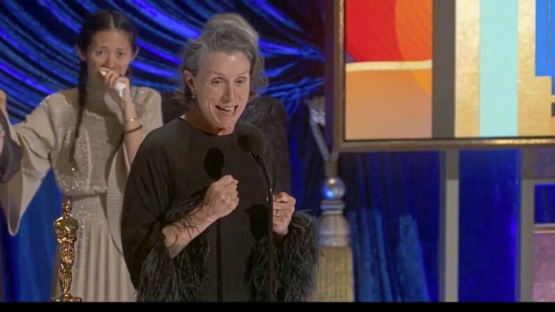 In this video image provided by ABC, Frances McDormand accepts the best picture award for &quot;Nomadland&quot; as director Chloe Zhao looks on at the Oscars. Picture by ABC via AP 